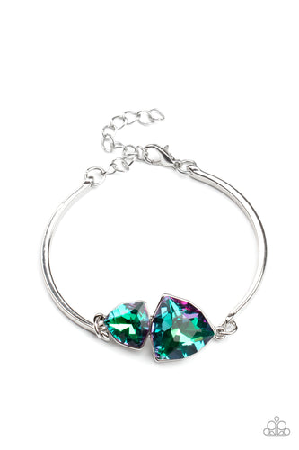 Featuring raw gem cuts, a pair of iridescent rhinestones connect to dainty silver bars around the wrist, creating a stellar cuff-like bracelet. Features an adjustable clasp closure.  Sold as one individual bracelet.