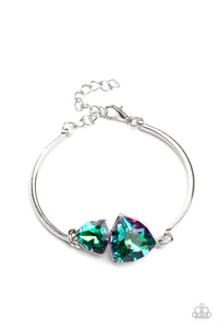 Featuring raw gem cuts, a pair of iridescent rhinestones connect to dainty silver bars around the wrist, creating a stellar cuff-like bracelet. Features an adjustable clasp closure.  Sold as one individual bracelet.
