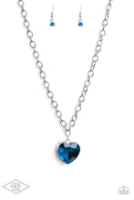 Load image into Gallery viewer, Set atop a sleek silver fitting, a glittery blue heart-shaped gem swings from the bottom of a classic silver chain below the collar for a whimsical look. Features an adjustable clasp closure.
