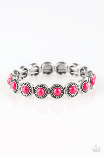 Dotted with vivacious pink beaded centers, studded silver frames are threaded along stretchy elastic bands and linked around the wrist for a whimsical look.