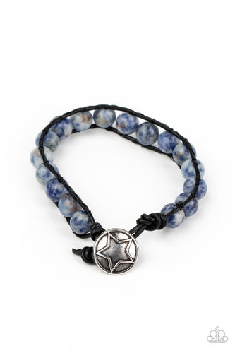 Infused with a decorative silver star embossed button, speckled blue stones are threaded in place between two dainty black cords around the wrist for a seasonal fashion. Features a button loop closure.  Sold as one individual bracelet.