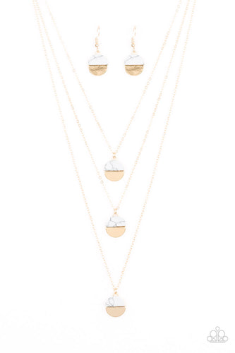 Featuring refreshing white stone accents, a trio of gold discs layer down the chest for a seasonal look. Features an adjustable clasp closure.  Sold as one individual necklace. Includes one pair of matching earrings.