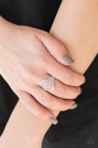 A cloudy pink bead is pressed into the center of a dainty silver band radiating with studded silver textures for a whimsical look. Features a dainty stretchy band for a flexible fit. 