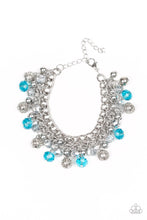 Load image into Gallery viewer, A collection of metallic net covered beads, shiny silver beads, and glittery blue and metallic flecked crystal-like beads swing from the wrist, creating a refined fringe. Features an adjustable clasp closure.
