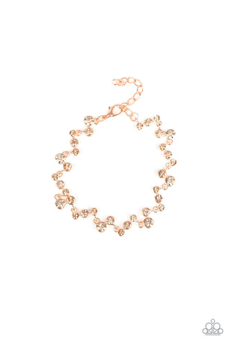 Varying in size, a collection of rhinestones connect across the wrist for a timeless look. Features an adjustable clasp closure.