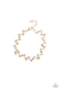 Varying in size, a collection of rhinestones connect across the wrist for a timeless look. Features an adjustable clasp closure.
