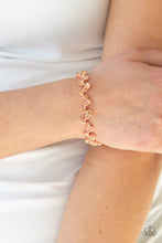 Load image into Gallery viewer, Varying in size, a collection of rhinestones connect across the wrist for a timeless look. Features an adjustable clasp closure.
