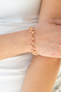 Varying in size, a collection of rhinestones connect across the wrist for a timeless look. Features an adjustable clasp closure.