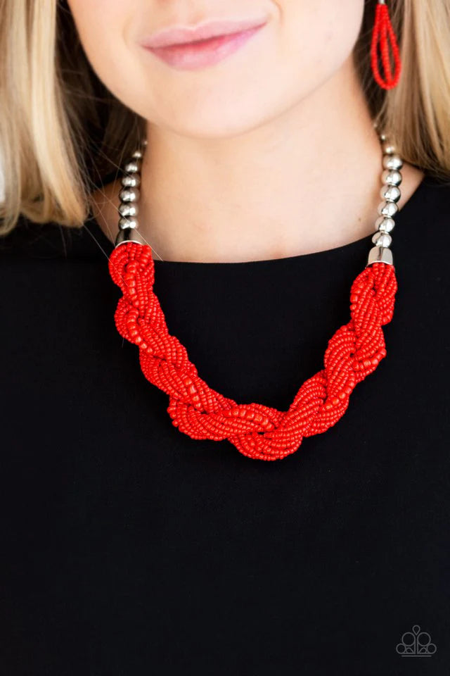 Glistening silver beads give way to strands of twisting red seed beads below the collar for a summery flair. Features an adjustable clasp closure.  Sold as one individual necklace. Includes one pair of matching earrings.