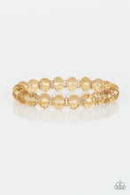 Load image into Gallery viewer, Glittery crystal-like beads and studded silver rings are threaded along a stretchy band around the wrist for a sophisticated look.
