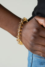 Load image into Gallery viewer, Glittery crystal-like beads and studded silver rings are threaded along a stretchy band around the wrist for a sophisticated look.
