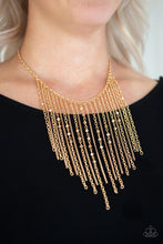 Load image into Gallery viewer, Varying in length, mismatched gold chains stream from the bottom of a classic gold chain. Faceted golden crystal-like beads sporadically dot the free-falling chains, creating a statement-making fringe below the collar. Features an adjustable clasp closure.
