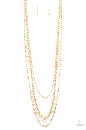 Three mismatched gold chains layer down the chest. Dainty white pearls cascade down one gold chain, adding a flirty twist to the timeless pearl palette. Features an adjustable clasp closure