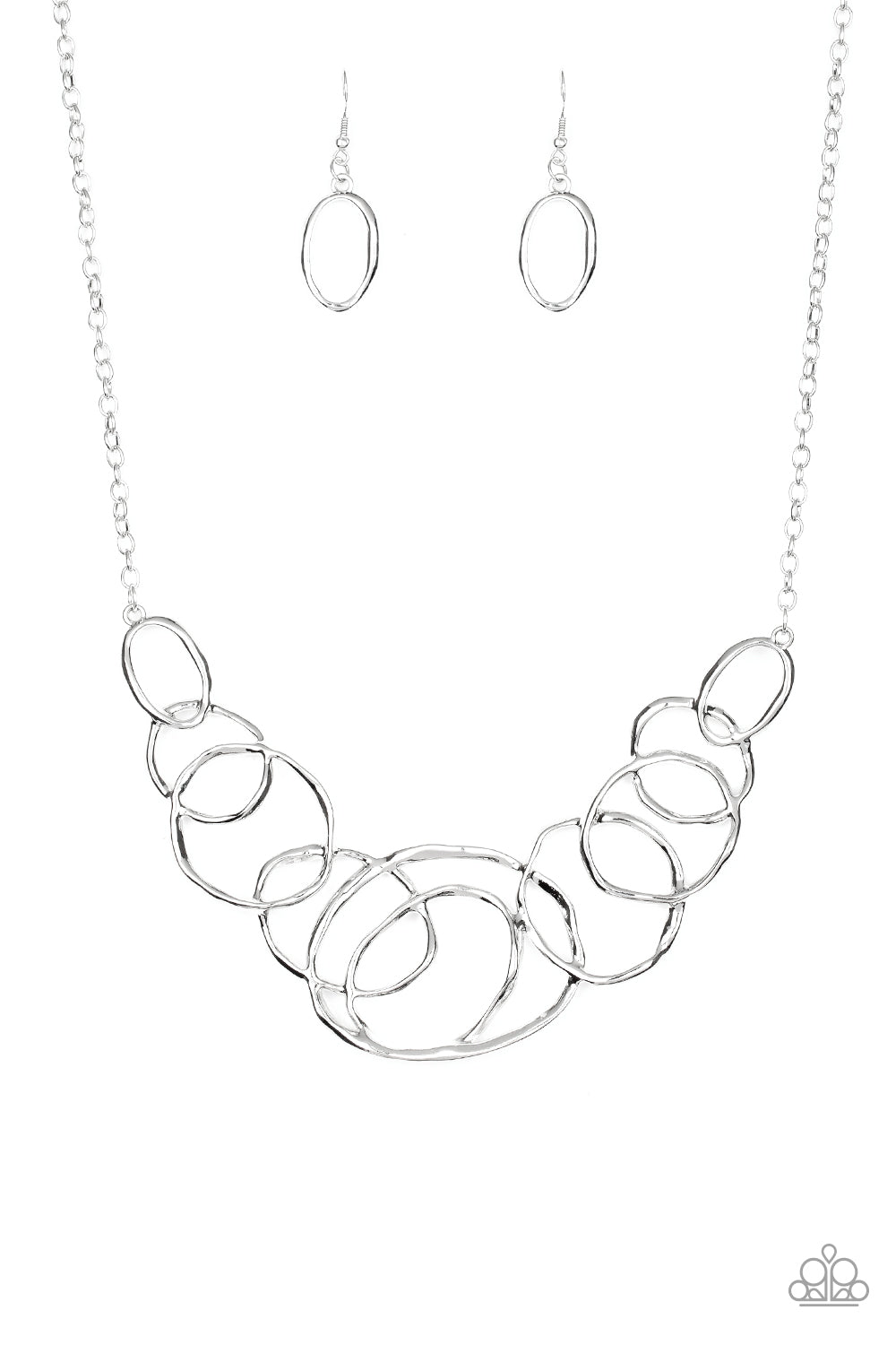 Featuring a subtle hammered finish, a collection of asymmetrical silver rings join into a stationary pendant below the collar for a bold look. Features an adjustable clasp closure