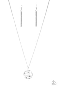 An oversized white gem swings from the bottom of a lengthened silver chain for a dramatic look. Features an adjustable clasp closure