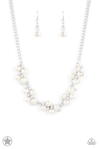 Dainty clusters of shimmery white pearls are dusted with sparkling rhinestones, creating a romantic, timeless design.  Features an adjustable clasp closure.