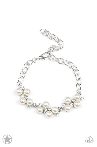 Small clusters of shimmery white pearls are dusted with sparkling rhinestones, creating a romantic timeless design.  Features an adjustable clasp closure.
