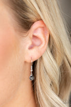 Load image into Gallery viewer, Featuring lifelike patterns, a hematite rhinestone encrusted silver leaf swings from the bottom of a lengthened silver chain, creating an edgy pendant. Features an adjustable clasp closure.
