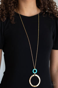 Featuring a delicately hammered finish, an oversized gold hoop links with a refreshing turquoise stone ring at the bottom of a lengthened gold chain for a sophisticated look. Features an adjustable clasp closure.