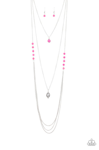 Infused with pink stone beads give way to layers of shimmery silver chain down the chest. A pink stone pendant and shiny silver frame drape above the cascade of silver chains for a seasonal flair. Features an adjustable clasp closure. 