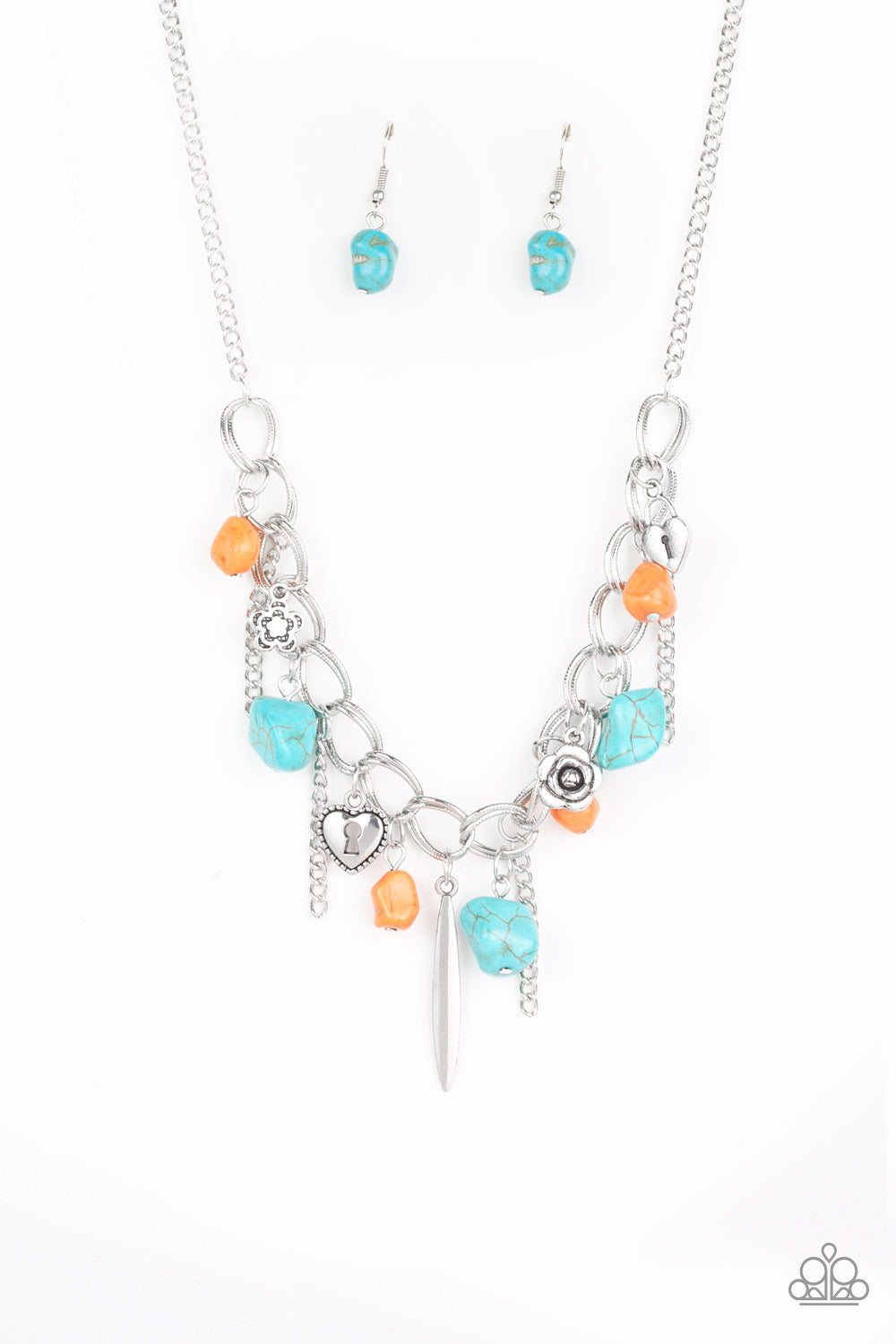 A whimsical array of turquoise and orange rock beads, glistening silver chains, and an assortment of floral and heart charms swing from a double-linked silver chain, creating a flirtatious fringe below the collar. Features an adjustable clasp closure. 