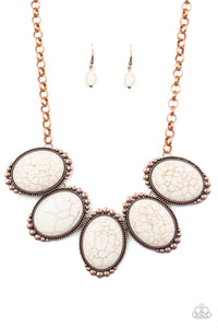 Chiseled into tranquil ovals, oversized white stones are pressed into antiqued copper frames radiating with studded textures. The refreshing frames delicately link below the collar for a statement-making finish. Features an adjustable clasp closure.