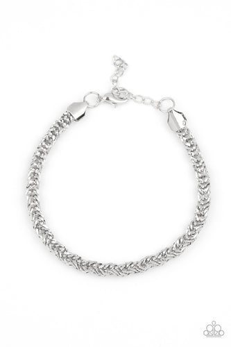 Brushed in a high-sheen finish, an ornate silver chain links around the wrist for a bold look. Features an adjustable clasp closure.