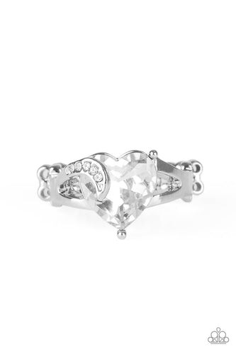 Infused with a dainty silver ribbon radiating with glassy white rhinestones, an oversized white heart-shaped rhinestone adorns the center of the finger for a romantic look. Features a dainty stretchy band for a flexible fit. 