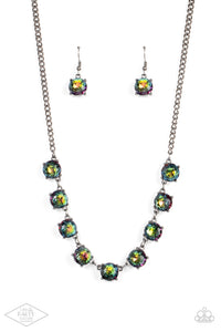 Featuring oil spill centers and sleek gunmetal fittings, a collection of oversized rhinestones link below the collar for an icy look. Features an adjustable clasp closure.