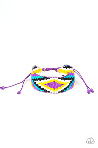 Threaded along invisible thread, a dainty collection of purple, blue, black, white, and yellow seed beads weave into a colorful textile pattern across the wrist for a tribal inspired look. Features an adjustable sliding knot closure.