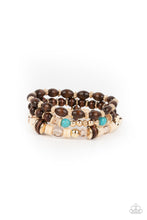 Load image into Gallery viewer, A mismatched collection of brown wooden beads, gold accents, turquoise stones, and glassy beads are threaded along stretchy bands, creating colorful layers around the wrist.  Sold as one set of three bracelets.
