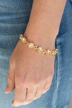 Load image into Gallery viewer, Golden rhinestone encrusted gold frames delicately link around the wrist, creating a timeless centerpiece. Features an adjustable clasp closure.  Sold as one individual bracelet.
