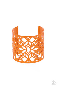 Featuring an airy floral stenciled design, a flamboyant orange cuff wraps around the wrist for a vivacious finish.
