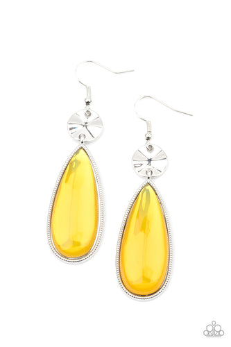 A creased silver disc gives way to a dramatically oversized glassy yellow teardrop frame, creating a colorful statement. Earring attaches to a standard fishhook fitting.