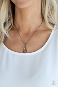 A glittery oil spill teardrop gem swings from the bottom of a glistening gunmetal chain, creating a stellar pendant below the collar. Features an adjustable clasp closure.