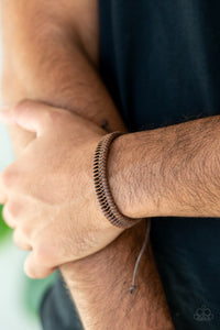 Rustic leather laces twist and weave around the wrist, creating a rugged centerpiece. Features an adjustable sliding knot closure.  Sold as one individual bracelet.