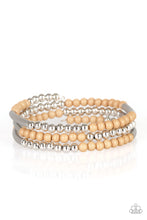 Load image into Gallery viewer, A collection of neutral brown and shiny silver accents are threaded along a long wire to create an infinity wrap bracelet. Coil design allows for an adjustable fit.
