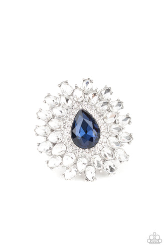 White teardrop petals fan out from a dramatic blue teardrop rhinestone center, stacking into a glamorous centerpiece atop the finger. Features a stretchy band for a flexible fit. 