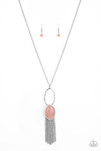 Nestled in a sleek silver frame, a dewy pink stone swings from the bottom of a hammered silver hoop at the bottom of a shiny silver chain. Dainty silver chains stream from the bottom of the tranquil stone pendant, creating a whimsical tassel. Features an adjustable clasp closure.