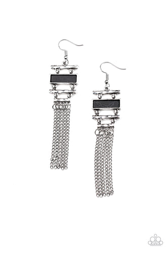 Infused with a flat black stone frame, hammered silver bars stack into an abstract lure. Shimmery silver chains stream from the bottom, creating a whimsical fringe. Earring attaches to a standard fishhook fitting.