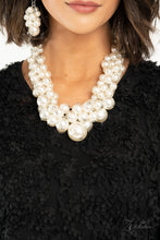 Load image into Gallery viewer, An exaggerated display of clustered pearls elegantly sweeps below the collar. The classic white pearls gradually increase in bubbly intensity as they reach the center of the regal piece, adding over-the-top timelessness to the unapologetic pearl palette. Features an adjustable clasp closure.  Sold as one individual necklace. Includes one pair of matching earrings.
