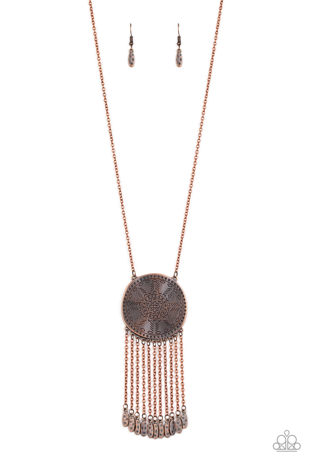 Stamped in a decorative floral pattern, an imperfect copper disc swings from the bottom of a lengthened copper chain. Copper chains and hammered copper beads stream from the bottom of the rustic pendant, creating a flirty fringe. Features an adjustable clasp closure.