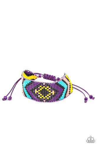 A dainty collection of purple, yellow, black, Rose Tan, and blue beads are delicately weaved into a colorful textile pattern across the wrist for a southwestern inspired fashion. Features an adjustable sliding knot closure.