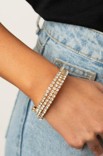 Featuring two oversized white rhinestone fittings, a glittery collection of white rhinestone encrusted gold frames are threaded along a gold wire around the wrist, creating a glamorous infinity wrap bracelet.