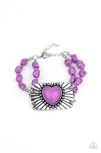 Threaded along invisible wire, strands of purple rock beads and dainty silver accents attach to a shimmery silver plate radiating with linear and studded textures. Chiseled into a charming heart, a purple stone adorns the center of the frame for a flirty finish. Features an adjustable clasp closure