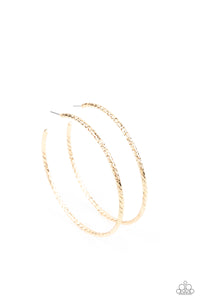 Etched in twisted diamond-cut texture, an oversized gold bar delicately curls into a dramatically oversized hoop. Earring attaches to a standard post fitting. Hoop measures approximately 2 1/2" in diameter.