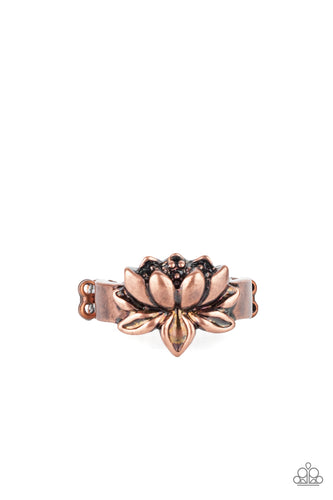 Brushed in an antiqued shimmer, a lifelike copper lotus embellishes the center of a dainty copper band for a whimsical look. Features a dainty stretchy band for a flexible fit.