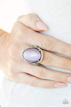 Load image into Gallery viewer, An oval Amethyst Orchid cat&#39;s eye stone is nestled inside a ring of white rhinestones featuring dainty heart details, creating a charming centerpiece atop the finger. Features a stretchy band for a flexible fit.
