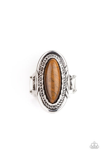 An oblong tiger's eye stone is pressed into the center of an oval silver frame stamped and embossed in mismatched patterns for a seasonal flair. Features a stretchy band for a flexible fit.