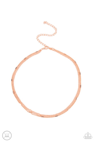 A dainty shiny copper beaded chain joins two rows of plain shiny copper chain around the neck, creating shimmery layers. Features an adjustable clasp closure.